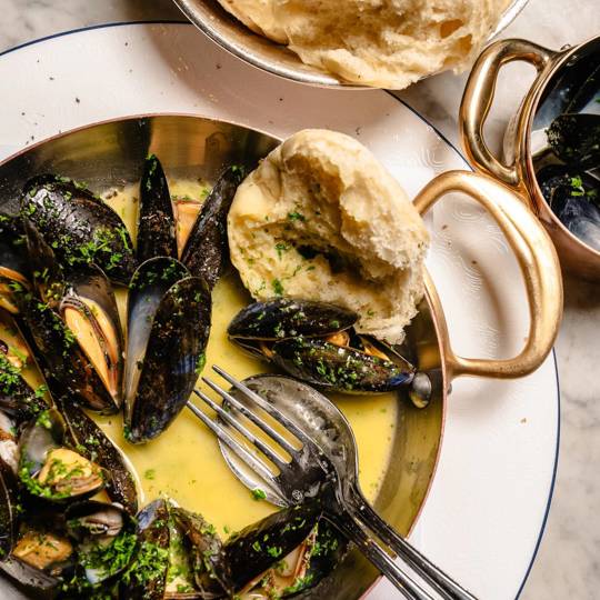 Steaming mussels with herbs and lemon at Bentley’s, a seafood restaurant in Mayfair.