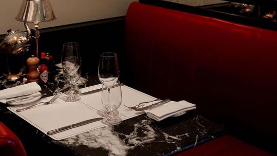 table laid at Bentley's Oyster Bar & Grill seafood restaurant in Mayfair, London
