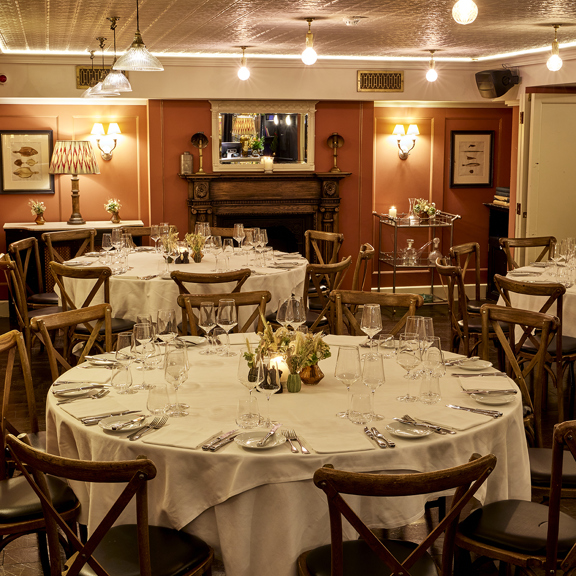 Cozy dining area with elegant lighting at Bentley’s