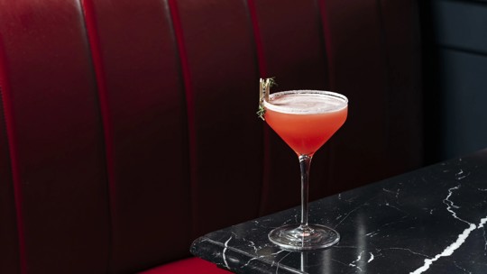 Red cocktail elegantly served at Bentley's Oyster Bar, a premier seafood restaurant in Mayfair.