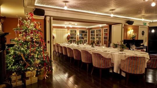 Cozy dining area with elegant table settings at Bentley’s Oyster Bar, a seafood restaurant in Mayfair.