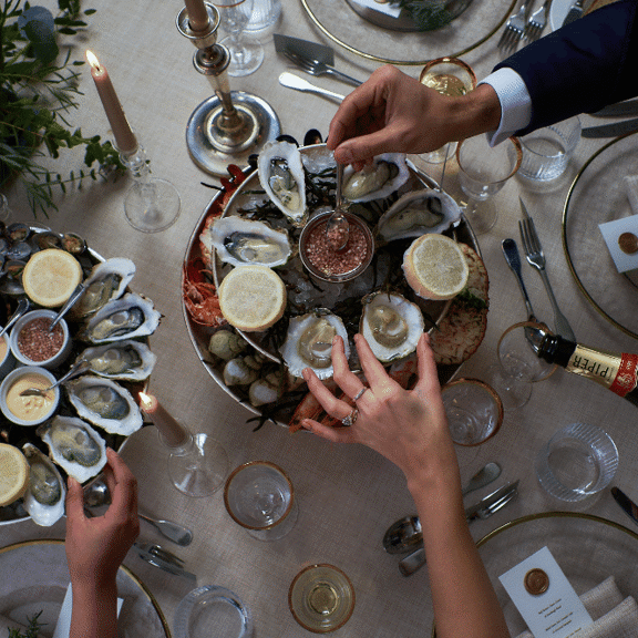 Oysters and champagne at Bentley's Oyster Bar & Grill seafood restaurant in Mayfair, London