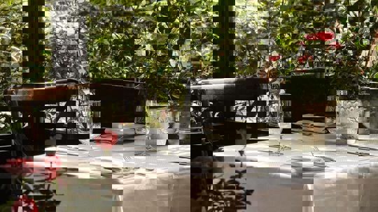 outdoor terrace table laid at Bentley's Oyster Bar & Grill seafood restaurant in Mayfair, London