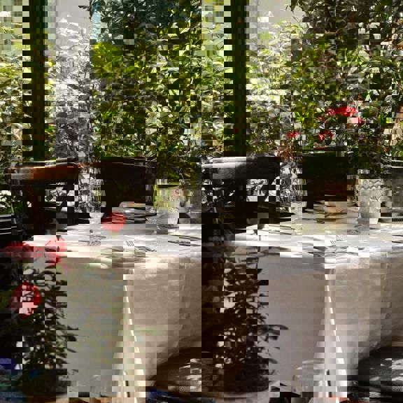 outdoor terrace table laid at Bentley's Oyster Bar & Grill seafood restaurant in Mayfair, London