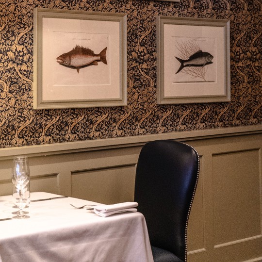 A table in the Grill Room at Bentley's seafood restaurant in Mayfair, London