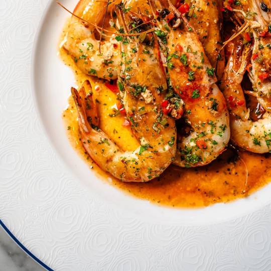 Grilled prawns with garlic butter, served at Bentley’s Oyster Bar, a top seafood restaurant in Mayfair.