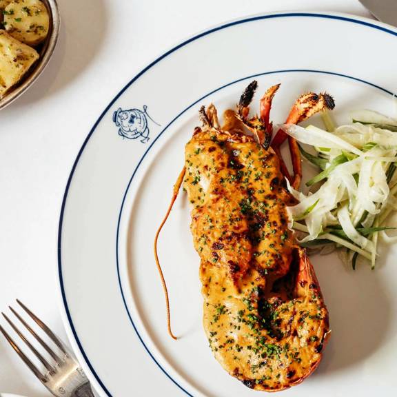 Lobster Thermidor served elegantly at Bentley's, a seafood restaurant in Mayfair.