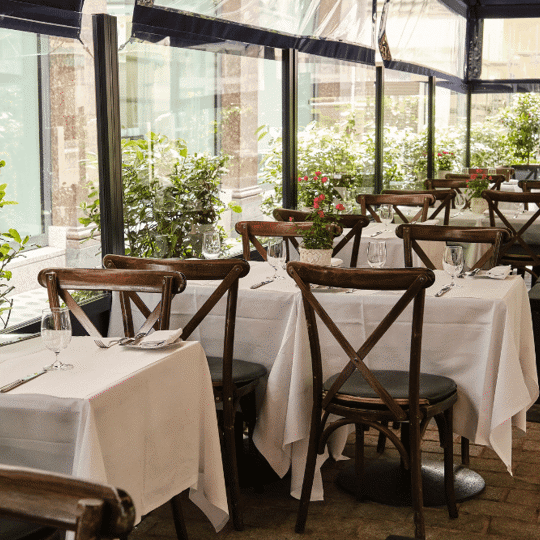 Outdoor dining terrace at Bentley's Oyster Bar & Grill seafood restaurant in Mayfair, London