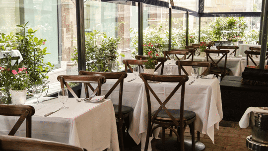 Outdoor dining terrace at Bentley's Oyster Bar & Grill seafood restaurant in Mayfair, London