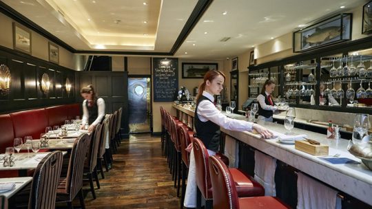 Waiting staff at Bentley's Oyster Bar & Grill in Mayfair, London