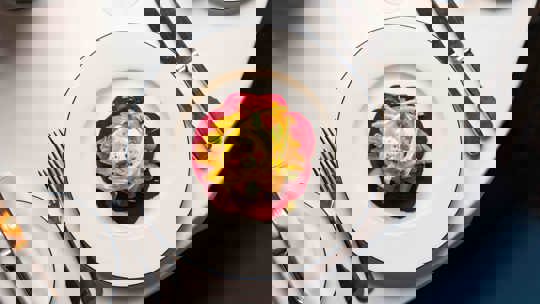 Festive table setting with candles and sparkling wine at Bentley’s Oyster Bar, a top fish restaurant in Mayfair.