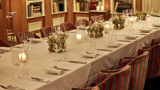 Elegant table setup with candles at Bentley’s, a distinguished restaurant in Mayfair London.