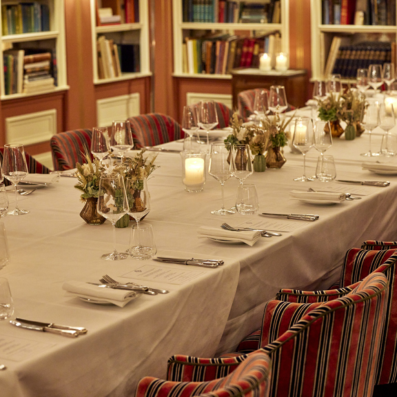 Elegant table setup with candles at Bentley’s, a distinguished restaurant in Mayfair London.