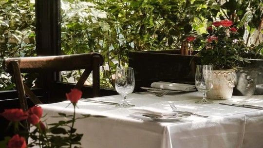 outdoor terrace table laid at Bentley's Oyster Bar & Grill seafood restaurant in Mayfair, London