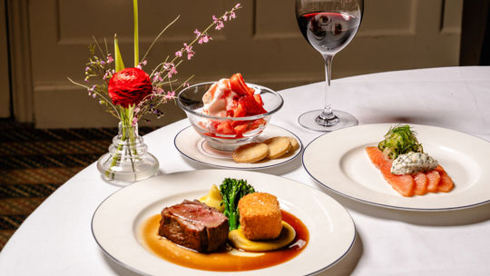 Elegant seafood dishes and a wine at Bentley's, a renowned seafood restaurant in Mayfair.