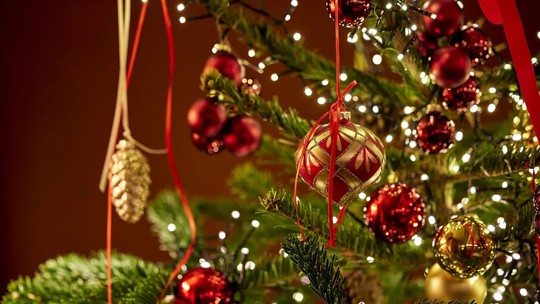 Festive holiday decorations with red and gold ornaments at Bentley’s