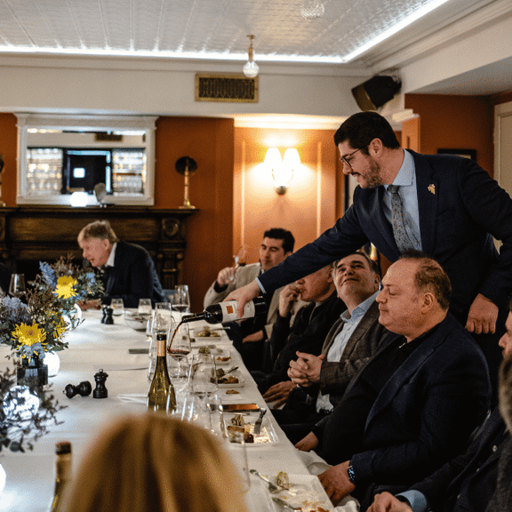 Pouring wine at Bentley's Oyster Bar & Grill in Mayfair, London
